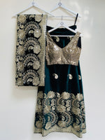Ambi green and gold velvet lehenga set